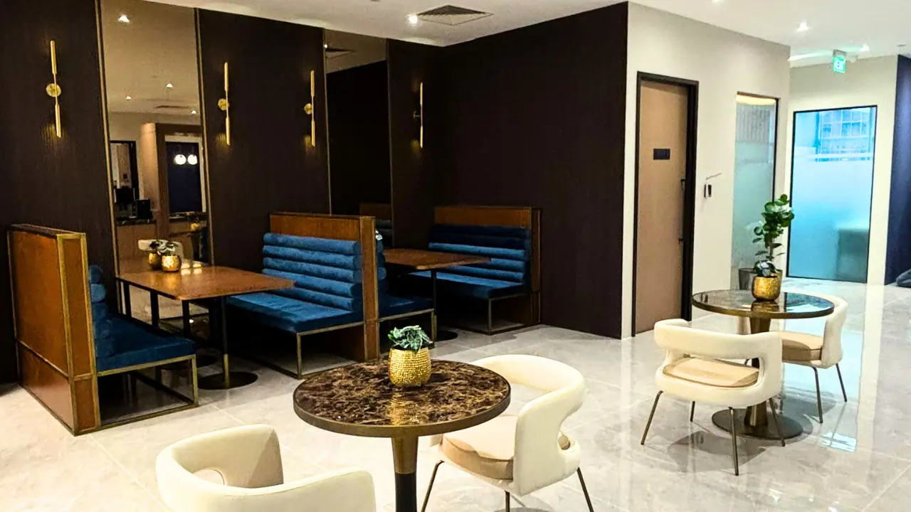Coworking lounge with booth and café-style seating at Workstudio Singapore